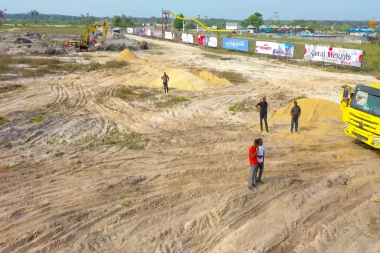 piece of land with people with coral heights